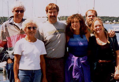 Steve and Suzanne with campground guests and boats